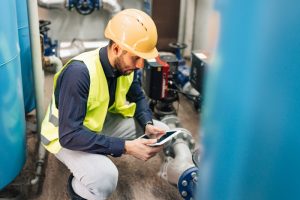 plumber-inspecting-complex-syste-of-pipes