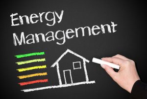 hand-writing-energy-management-on-chalkboard