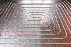 Close up on water floor heating system interior. plumbing pipes. Individual Heating.